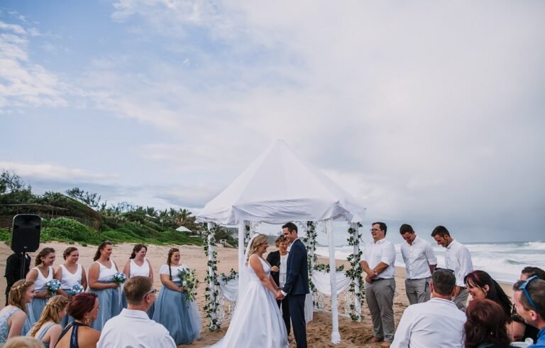 Bride and Groom Saying their vowels at a Beach Wedding Ceremony.